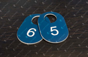 номерок для гардероба овальной формы